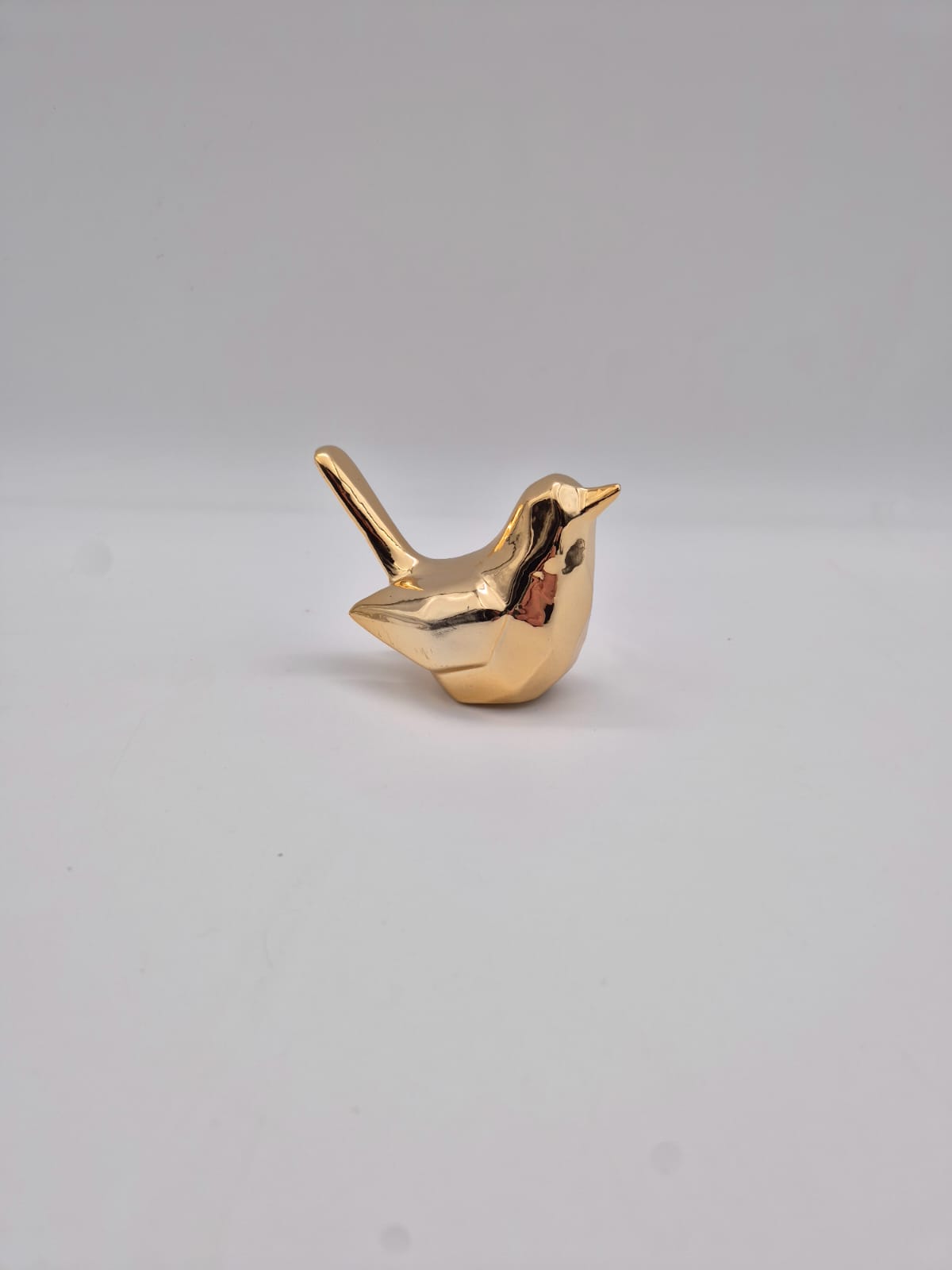 ציפור קטנה זהב חרסינה (192בקרטון)